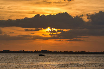 Scenic view of sea against orange sky