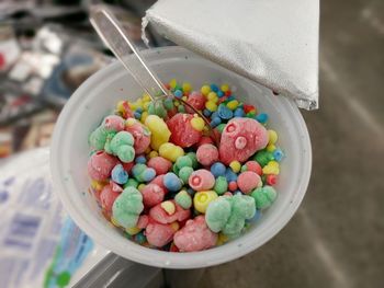 High angle view of multi colored candies in container