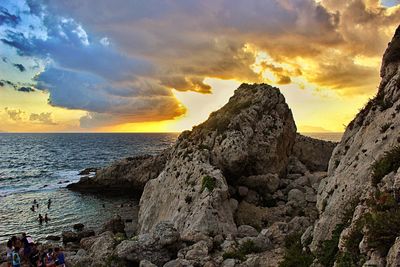 Scenic view of sea against sky at sunset