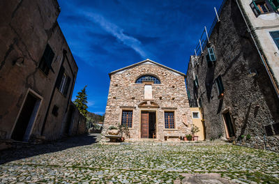 Low angle view of old building against sky