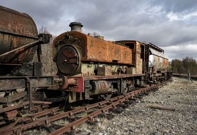 Train on railroad tracks against sky