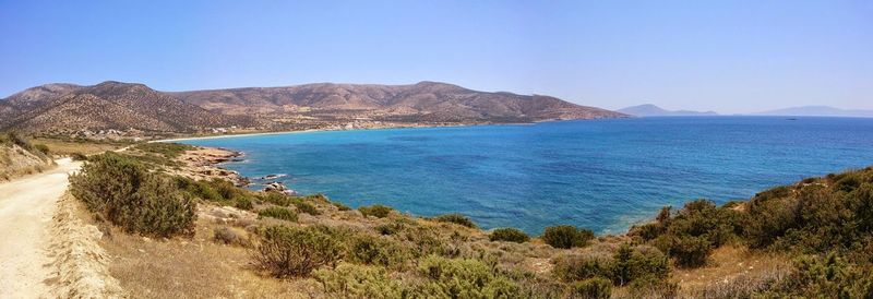 Scenic view of sea against clear blue sky