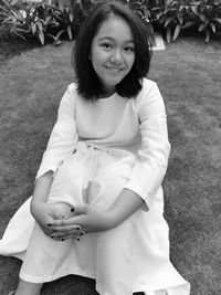 Portrait of smiling girl standing outdoors