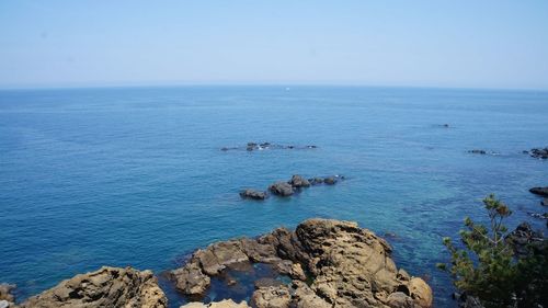 Scenic view of sea against clear blue sky