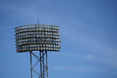 Low angle view of water tower against blue sky