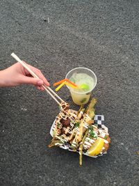 High angle view of woman holding food