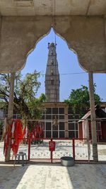 View of temple against building