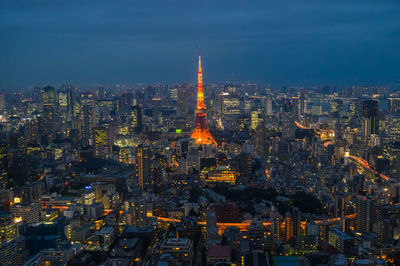 Aerial view of illuminated buildings in city