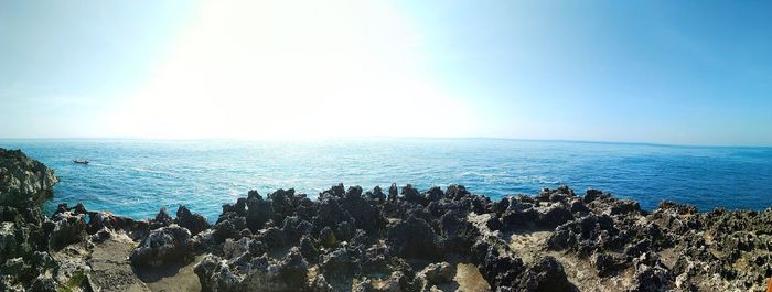 Scenic view of sea against clear blue sky