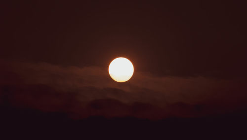 Low angle view of sun against sky during sunset