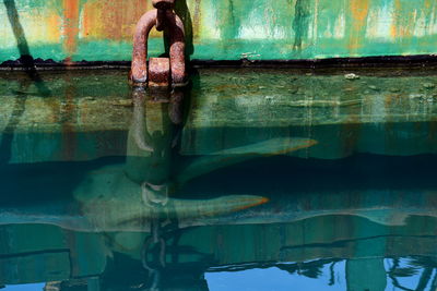 Old rusted anchor chain on an old green ship