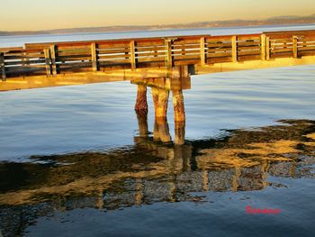 Pier over sea against sky