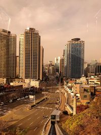 High angle view of buildings in city against sky