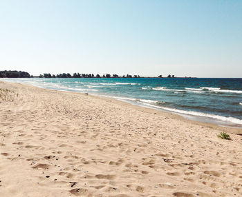 Scenic view of beach against clear sky