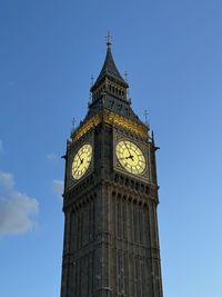 Low angle view of building against clear blue sky