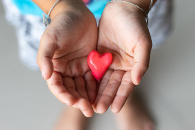 Close-up of hands holding heart shape