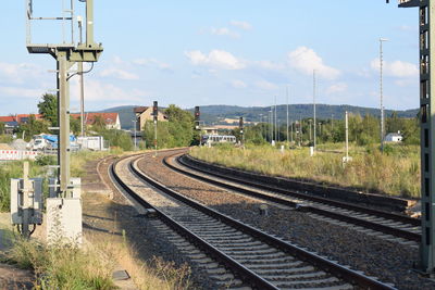 Train on railroad tracks against sky