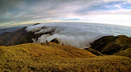 Scenic view of sea against cloudy sky