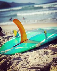 Close-up of toy on beach