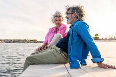 Side view of woman sitting on boat