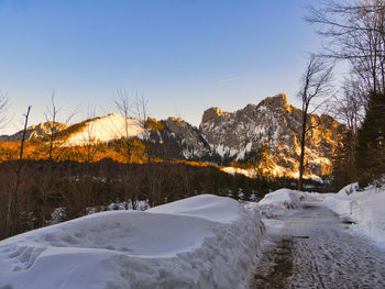 Scenic view of snow covered mountains against sky