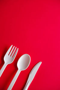 High angle view of plastic and red colored background