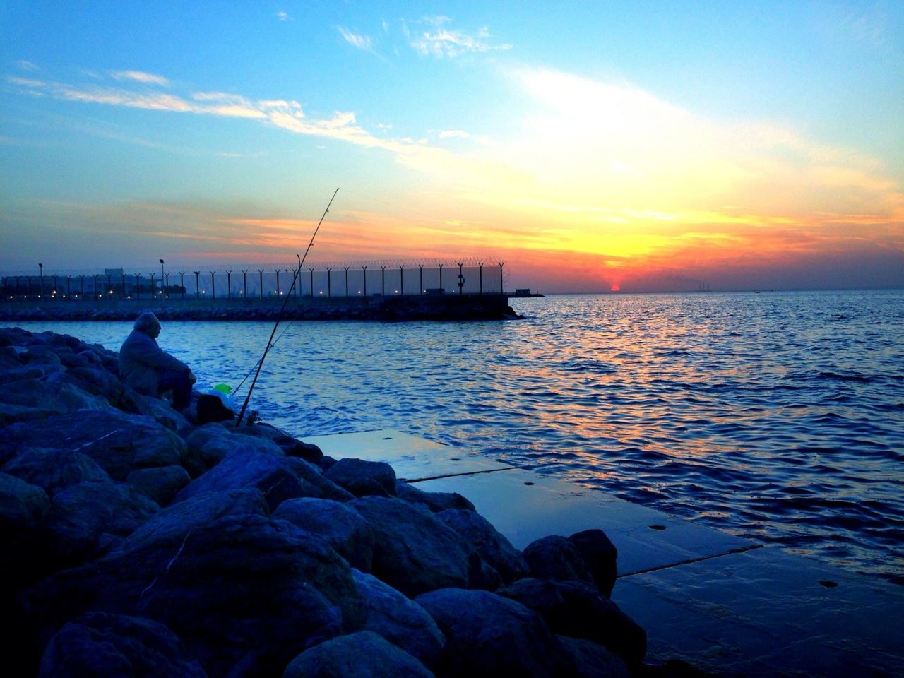 water, sunset, sea, sky, silhouette, scenics, tranquility, tranquil scene, beauty in nature, nature, horizon over water, idyllic, cloud - sky, rock - object, reflection, dusk, cloud, outdoors, rippled, orange color