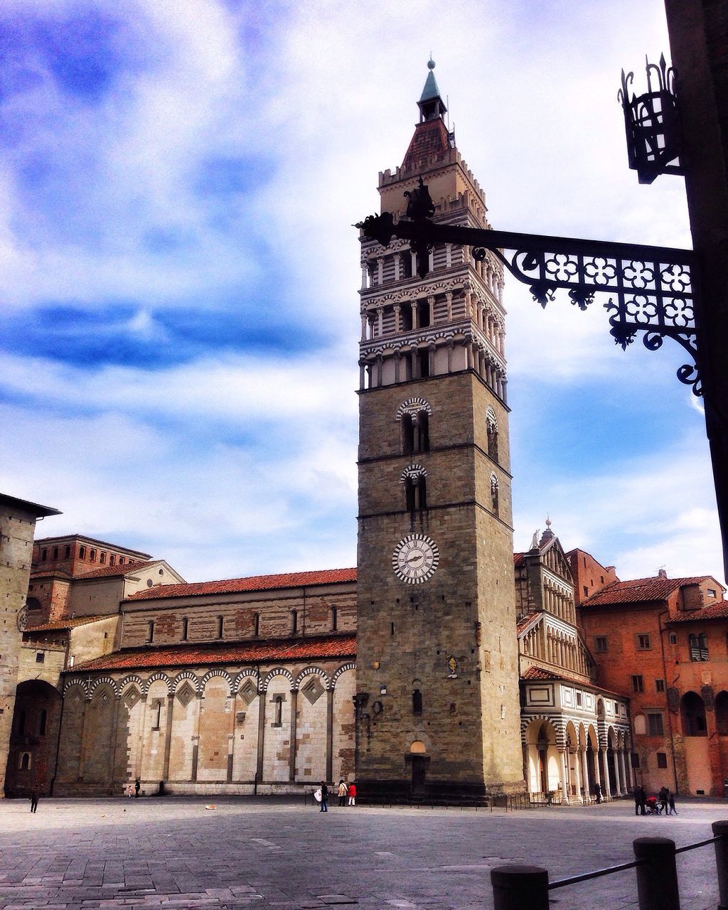 architecture, building exterior, built structure, sky, religion, church, clock tower, history, low angle view, place of worship, tower, spirituality, city, old, travel destinations, cloud - sky, cathedral, famous place