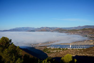 View of the city of motril covered in fog, from the mountain