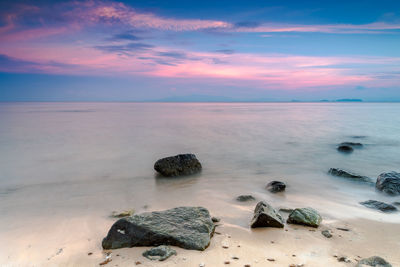 Scenic view of sea against sky at sunset