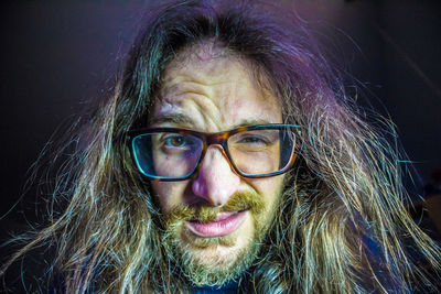 Close-up portrait of man with long hair