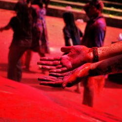 Close-up of hands on cross