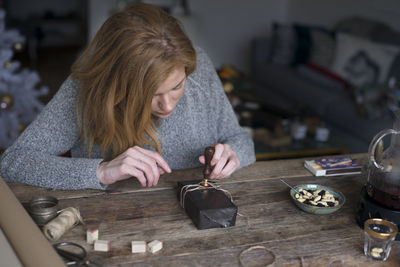 Woman sealing present