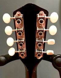 Close-up of guitar against black background