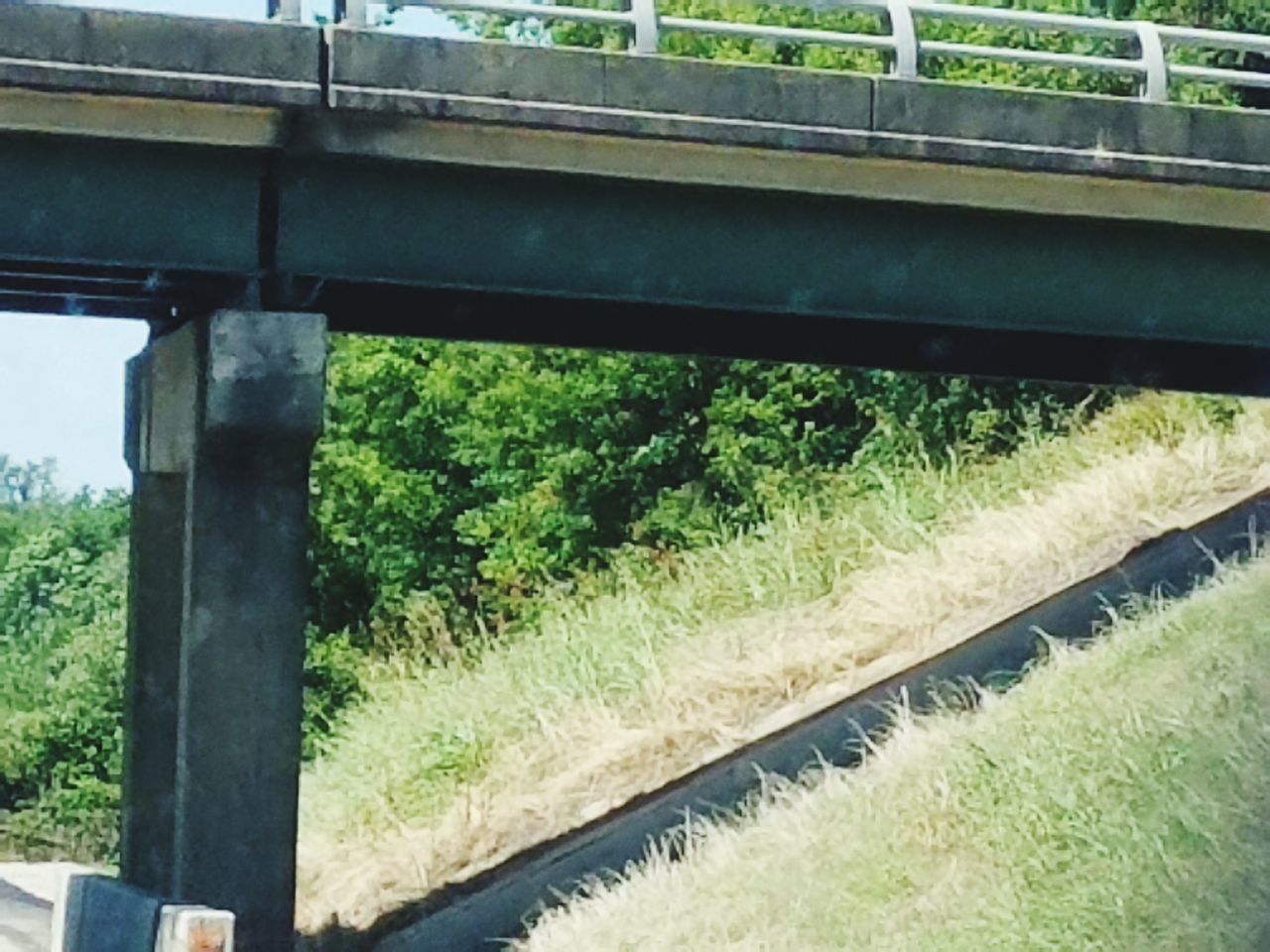 RAILROAD TRACKS AMIDST BRIDGE