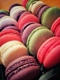 Close-up of colorful macaroons arranged in container