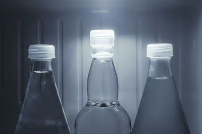 Close-up of wine glasses in glass