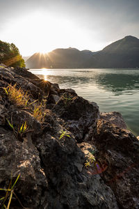 Scenic view of lake and mountains against sky