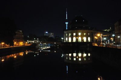 Illuminated buildings in city at night