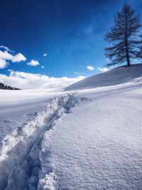 Scenic view of snow covered mountain against sky
