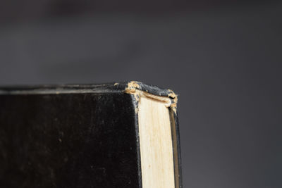 Close-up of metal on table against black background