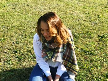 Woman sitting on field