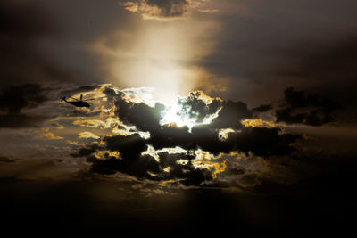 View of sun shining through clouds
