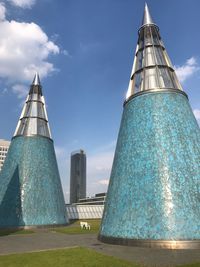 Low angle view of building against cloudy sky