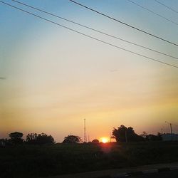 Electricity pylons at sunset