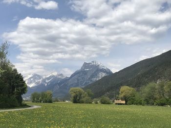 Scenic view of landscape and mountains against sky