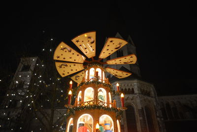 Low angle view of illuminated building at night