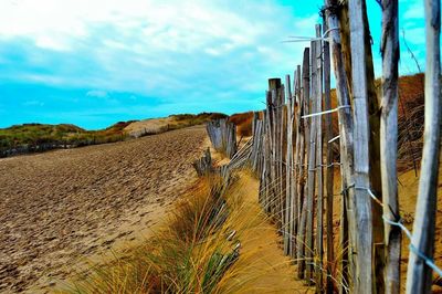 View of road against blue sky and clouds