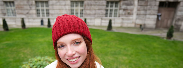 Portrait of young woman in city