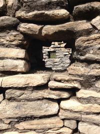 Low angle view of stone wall